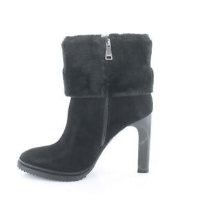 Plush faux-fur cuffs a gorgeous stiletto lift in the Sonya booties from DKNY